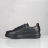 a black shoe on a white surface Alexandera Luxe Noir